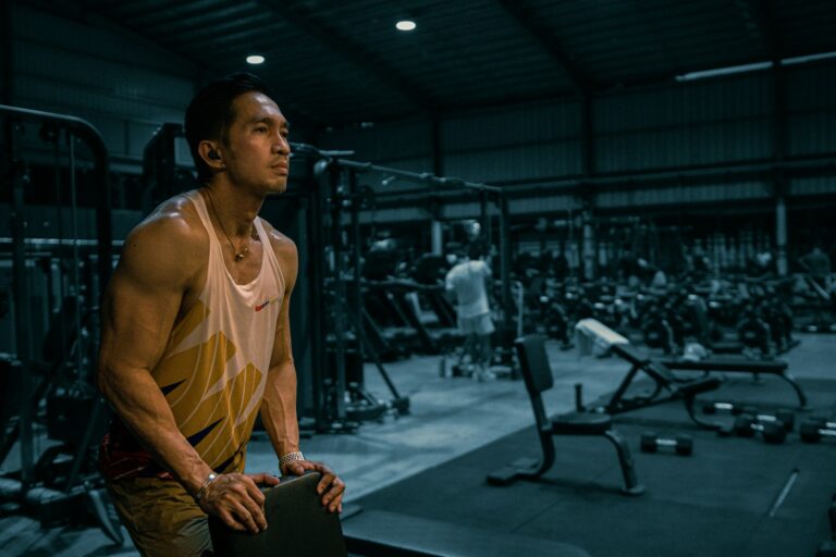 A man is working out at the gym.